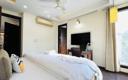 What is the Minimum Stay Duration at Olive Service Apartments in Delhi?